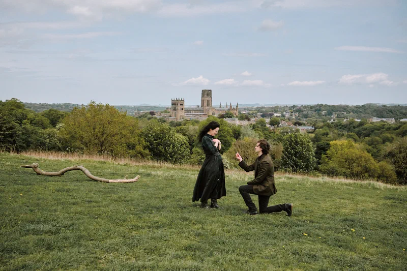 A marriage proposal on Observatory Hill with Durham Cathedral in the distance